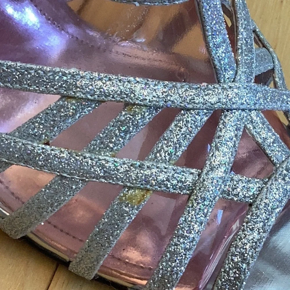 Nina silver glittery, strappy high heels, zipper to back. Women’s size 7
